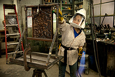 Applying a patina on bronze.